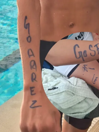 The spirit of the team. Swimmers writing "Go Aarez" and "Go SFIA" on their arms to support their teammate. This is what our swim family is all about.