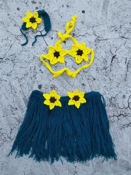 Another look at the complete tribal photoshoot set. This image clearly shows all three pieces: the grass-style skirt, the sunflower-shaped bikini top, and the matching headband.