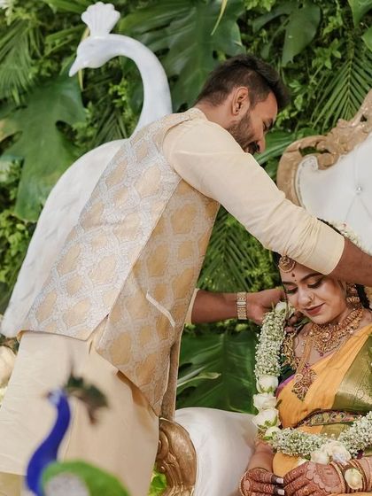 A tender moment during a Seemantham ceremony, with the decor I arranged providing a beautiful and traditional setting. It's moments like these that make my work so rewarding.