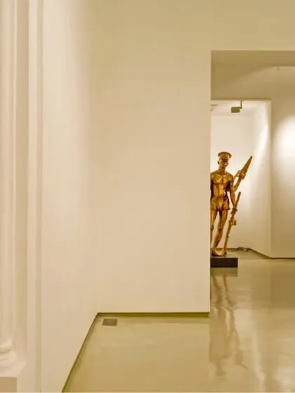 A view through a series of arched openings in the Sakshi Art Gallery. The design leverages the existing layout of the heritage building to create layered views and a sense of discovery as one moves through the space.