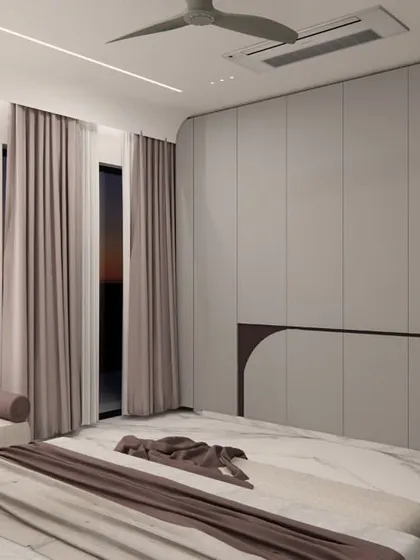 This view of the SVASA 2A master bedroom highlights the custom wardrobe. The doors feature a unique, flowing inlay that breaks the monolithic surface, turning a functional element into a piece of sculptural art.