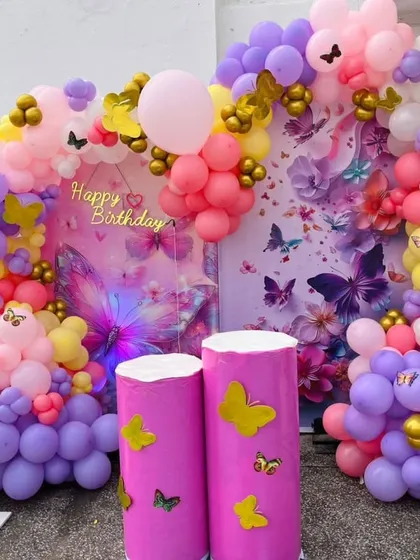 Another shot of the butterfly backdrop, showing the detailed arrangement of balloons and butterfly stickers.