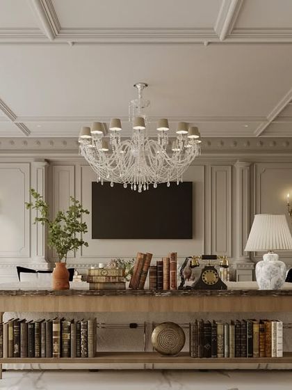 A console table behind the sofa serves as both a functional and decorative element in this family lounge. It helps to divide the space while providing a surface for books, lamps, and curated objects that add personality.