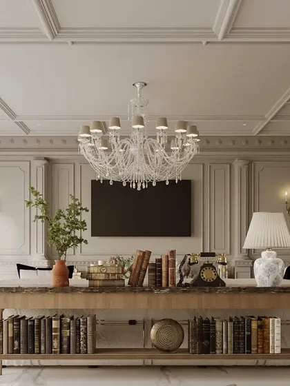 A console table behind the sofa serves as both a functional and decorative element in this family lounge. It helps to divide the space while providing a surface for books, lamps, and curated objects that add personality.