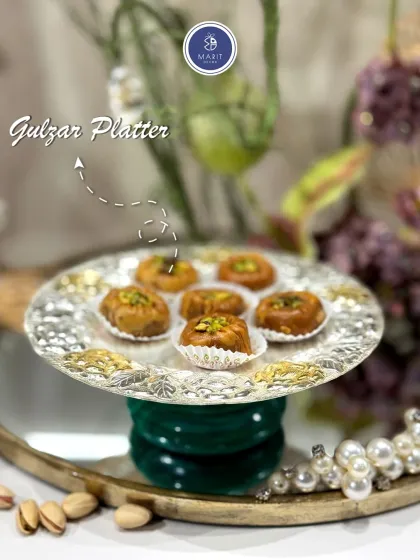 A close-up of the Gulzar Platter, featuring an intricate floral border. It's the perfect size for serving 'mithai' or other small delicacies with grace.