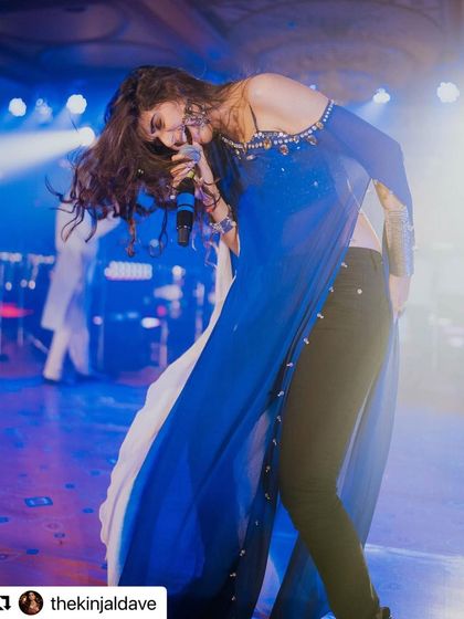 Rocking out on stage. The movement captures the edgy and powerful vibe of our oxidised silver collection. It's jewellery that's made to move with you.