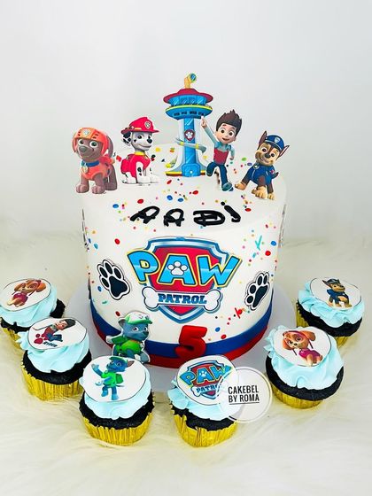 A Paw Patrol cake and cupcake set. The main cake features the whole team, while the matching cupcakes are perfect for sharing with party guests.