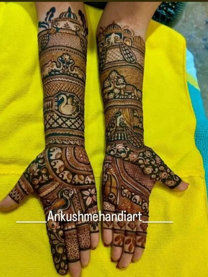 A beautiful, dense design featuring peacocks, elephants, and a doli, perfect for a bride who loves traditional but detailed artwork.