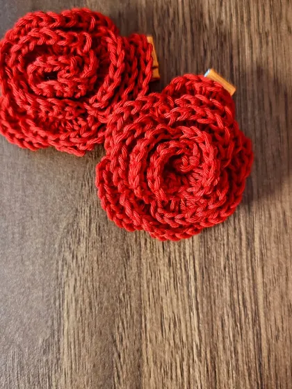A pair of my signature red rose hair clips. The petals are layered to give them a realistic, 3D look. They are one of my most requested items.