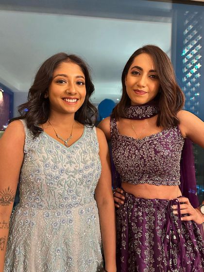 Beautiful sisters ready for a party. I created complementary looks for them, one with a soft, natural finish and the other with a touch of color on the eyes.