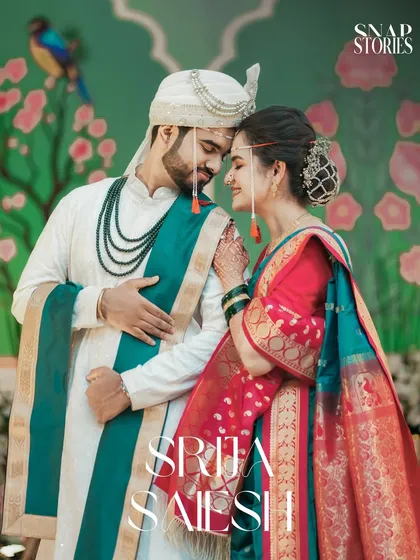 A romantic portrait of a Maharashtrian couple against a beautifully painted backdrop. We love incorporating unique decor and vibrant colors to create stunning, memorable wedding photos.