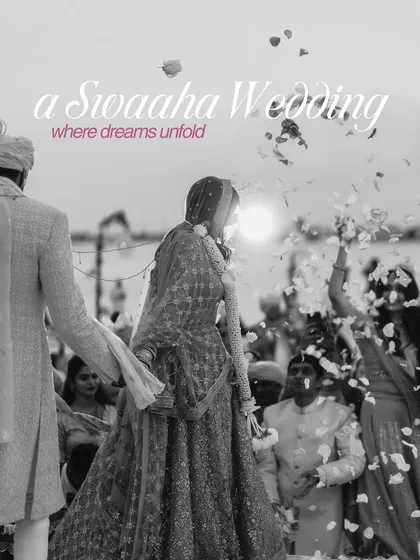A timeless black and white photo of the bride's processional, with flower petals showering down, capturing a moment of pure magic.