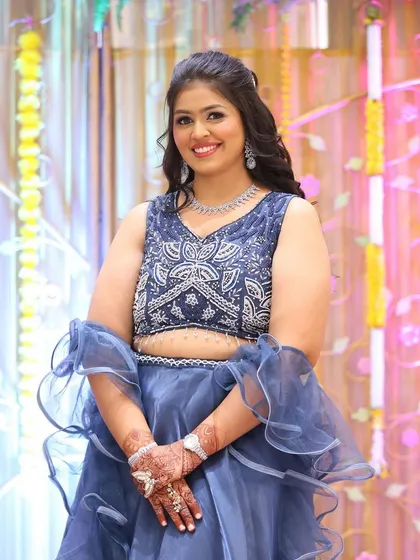 Another angle of this stunning blue lehenga look. The makeup is balanced to be visible and beautiful in professional event photography.