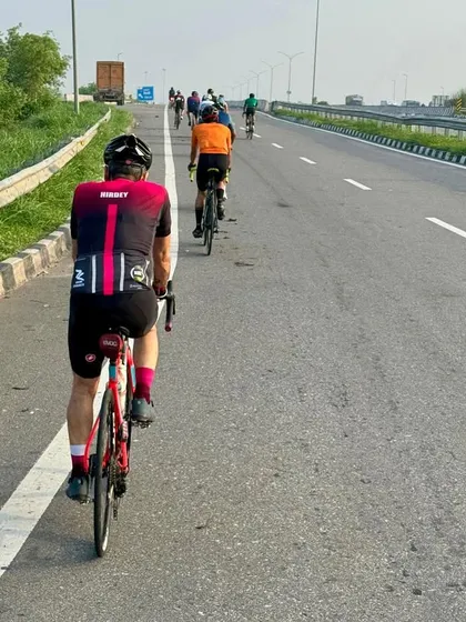 Taking on the open highway during a 100 km century ride. Our endurance cycling challenges are all about building stamina and mental fortitude as a group, covering long distances together.