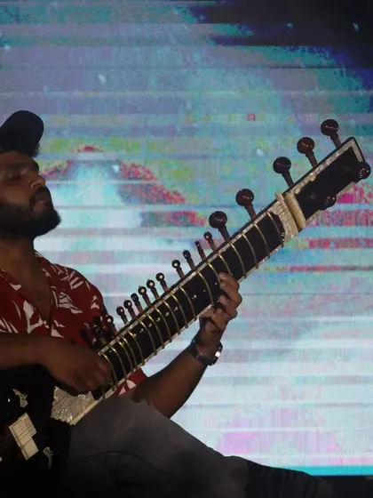 Immersed in the music during a live show. This is where I feel most alive, connecting with the audience through the strings of my sitar.