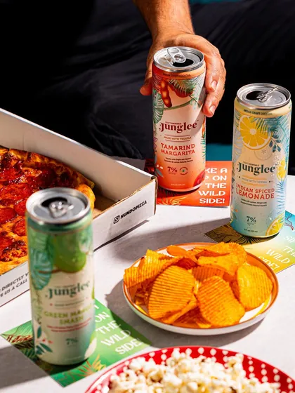We show products in relatable, everyday moments. Here, Junglee cocktails are paired with pizza and chips, creating a perfect "night in" scene that resonates with consumers.