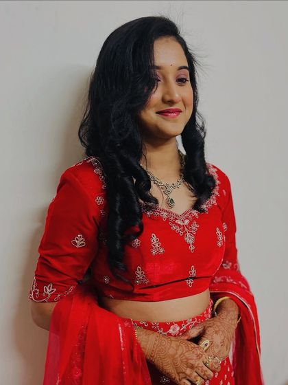 This shot highlights the soft, voluminous curls I created for her reception. The hairstyle is designed to have movement and stay beautiful through hours of dancing and celebrating.