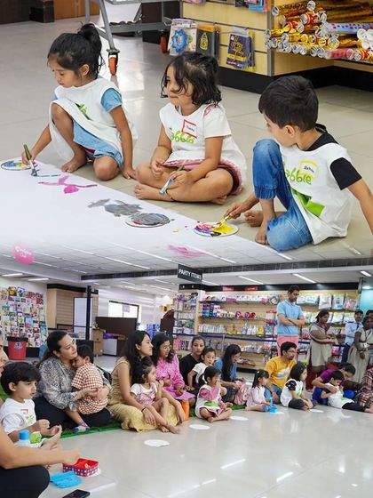 Parents and children enjoying our Playart Party together. Our events are designed for family participation, providing a wonderful opportunity to bond over a shared creative activity in a fun, relaxed setting.