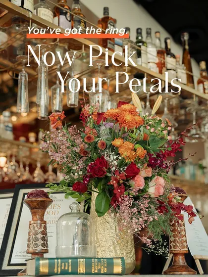 A beautiful floral arrangement at a bar, reminding us that every corner is an opportunity for beauty. We use fresh, vibrant flowers to add life and color to every part of the event space.