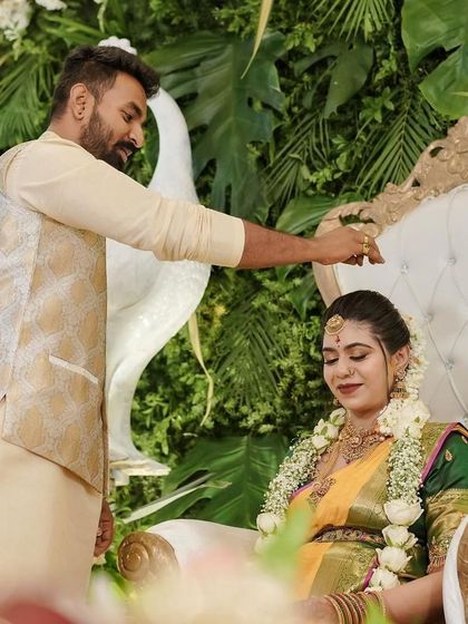 Capturing the blessings at a baby shower. The husband-to-be blesses his wife, seated on an elegant throne surrounded by my traditional decor.