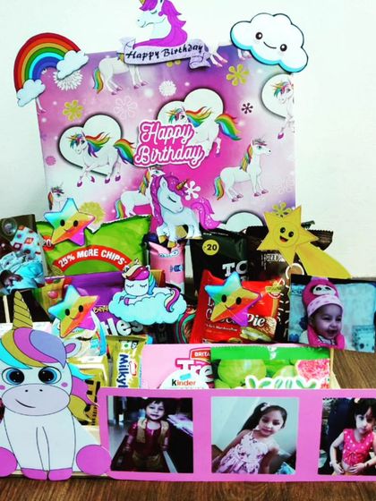 Bring a little magic to their birthday with this unicorn-themed hamper. It's filled with colorful snacks, personalized photos, and plenty of unicorn and rainbow cutouts for a truly enchanting gift.
