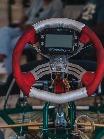 A detailed view of the steering wheel and MyChron data logger. This is the driver's command center, where they receive real time information during a race.