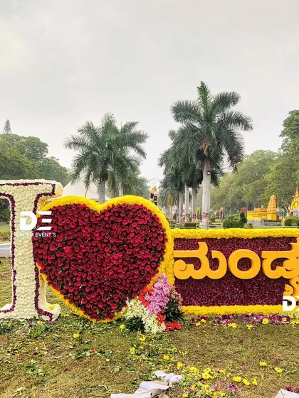 To celebrate our community pride, I designed and built this "I ❤️ Mandya" sign, with the text in Kannada, entirely from flowers. This installation became a beloved photo spot at the flower show, showing how floral art can bring people together.