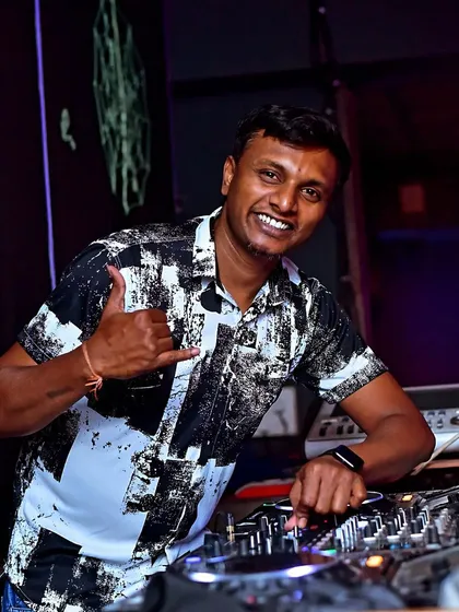 A quick moment of calm behind the console before the beat drops. This is my happy place, getting ready to mix the next banger for the dance floor.