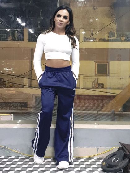 Even outside of workout gear, the results of strength training are visible. A strong core and confident posture.