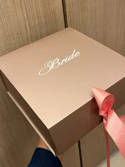 A beautiful rose gold box personalized for the 'Bride', perfect for filling with gifts to celebrate her new journey.