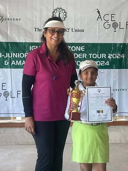 Dhriti Singh receives her winner's trophy at the IGU North Zone Sub-Junior Golf Championship.