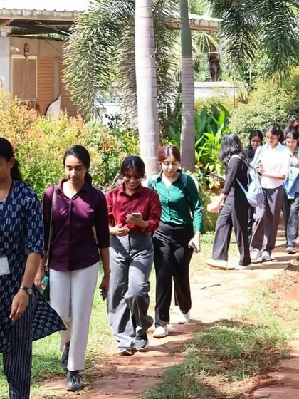 Students from SCMS Bengaluru walk through the green pathways of our farm. Our tours are designed to be both educational and a refreshing break from the city.
