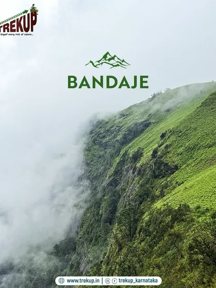 The sheer cliff face at Bandaje, draped in monsoon mist. This view captures the raw, untamed beauty of the Western Ghats that you'll experience on our trek.