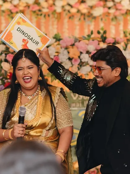 Laughter is the best icebreaker. Here I am playing a fun game with the bride, and her expression of pure joy is exactly what I aim to create at every event.