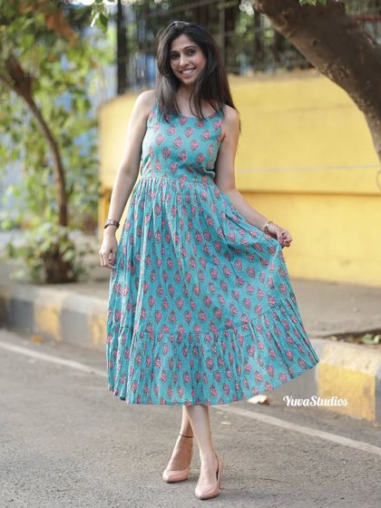 My breezy printed spaghetti strap dress, styled for a casual day out. It’s cool, chic, and perfect for beating the summer heat.