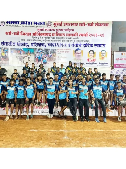 A full squad photo at the Mumbai Suburban District Championship, celebrating 10 years of victory.