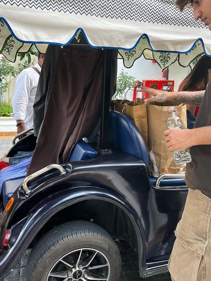 The reality of a stylist's life on set! Here's a look at my mobile wardrobe setup in a golf cart, making sure every outfit is ready for the next shot.