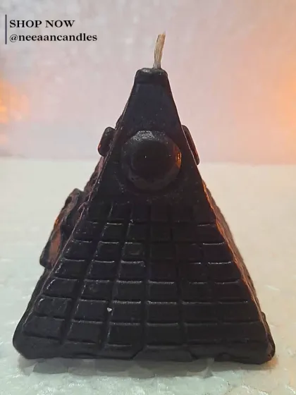 Awaken the ancient power. Our handcrafted black Eye of Horus pyramid candle represents protection, intuition, and mystery in one bold piece.