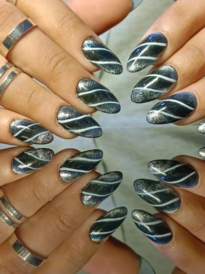 A full set of the striped black and silver glitter nails, perfect for a night out.