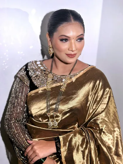 A timeless beauty look in a golden saree. The makeup is inspired by Latina makeup styles, with a sharp contour and defined eyes.
