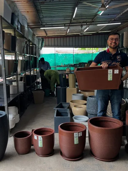 Here you can see a matching set of roto pots in a beautiful antique brown color. I have them in various sizes, from small tabletop versions to large floor planters, allowing for a coordinated decor theme.