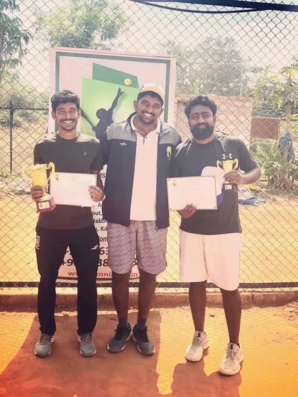 The winner and runner-up of the Tennis360 Men's Open Tour proudly display their trophies and certificates, highlighting the competitive opportunities available for adult players.