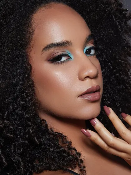 A pop of turquoise liner paired with a sharp wing. This look from our Bangalore portfolio shoot demonstrates how to use color for a striking yet clean effect.