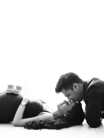 Sometimes, the most powerful moments are the quietest. This black and white maternity portrait focuses purely on the connection and anticipation between the expecting parents, creating a classic and emotional image that will be cherished forever.
