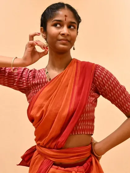 Anvita's expressive glance during a practice session. Even in rehearsal, we focus on embodying the character and emotion of the piece.