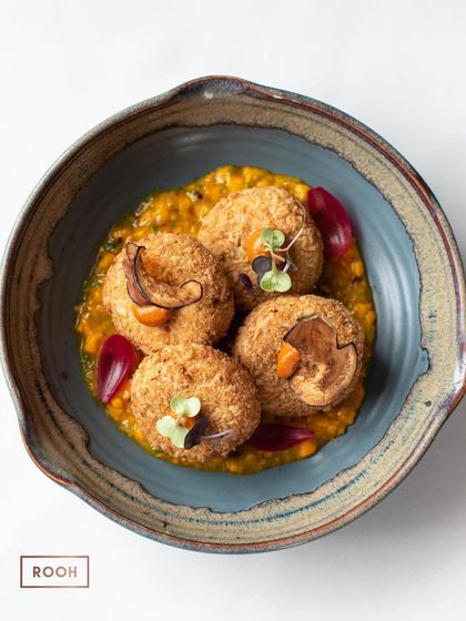 Our Cheese and Yogurt Cutlets, served on a bed of savory lentil ragout and garnished with beetroot slivers. A popular choice from our à la carte menu.