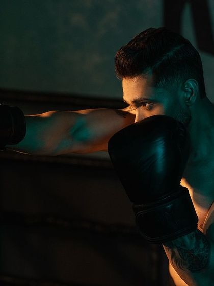 A close-up shot of me in a boxing pose, conveying focus and intensity. The goal is a process, not a destination.