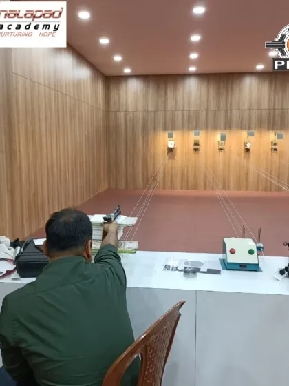 A participant takes aim with an air pistol during a recreational session. Our range is equipped for both 10m air rifle and 10m air pistol shooting, allowing you to try both disciplines.
