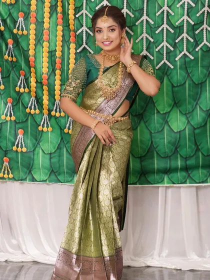 A full-length view of the bride, showing how the complete set, including the vaddanam, creates a cohesive look.