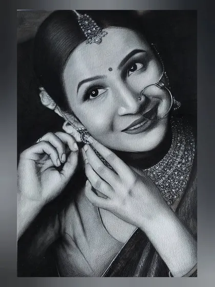 This is the completed charcoal and graphite portrait of a bride. I paid special attention to the textures, from the soft shading on her skin to the intricate sparkle of her traditional jewelry, creating a piece that is both realistic and full of life.